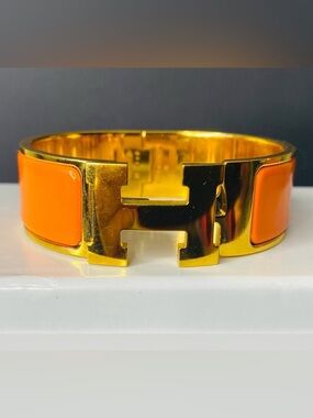 HERMES Signature Orange Enamel and Gold Plated Clic-Clac H GM Wide Bracelet